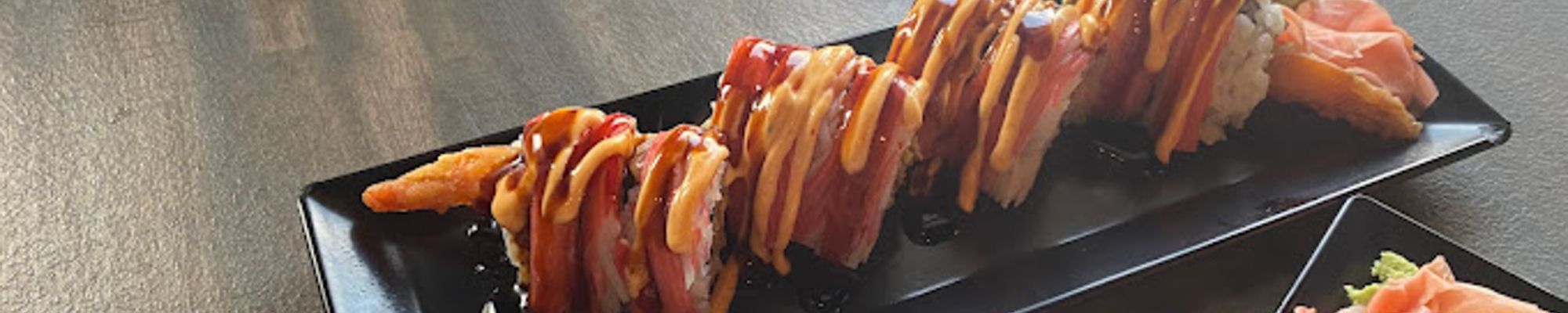 Tray filled with a roll sushi