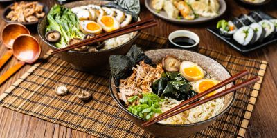 two beautiful bowls of ramen with a soft-boiled egg